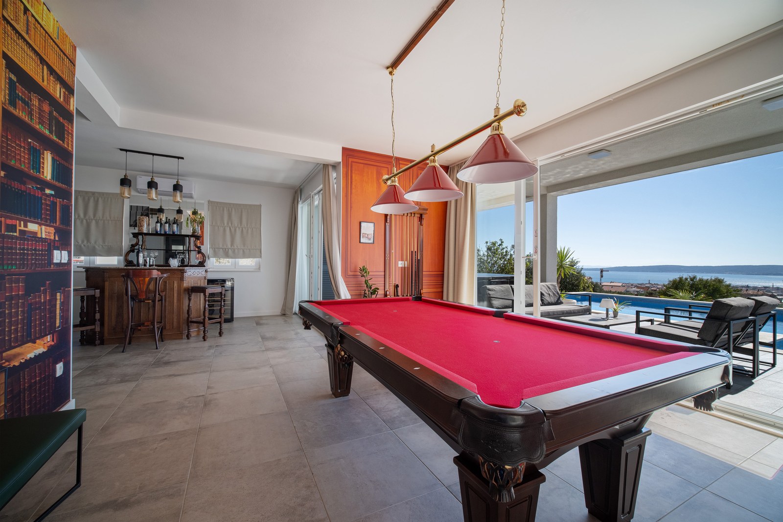 Billiards table and private bar opening onto a sea-view terrace